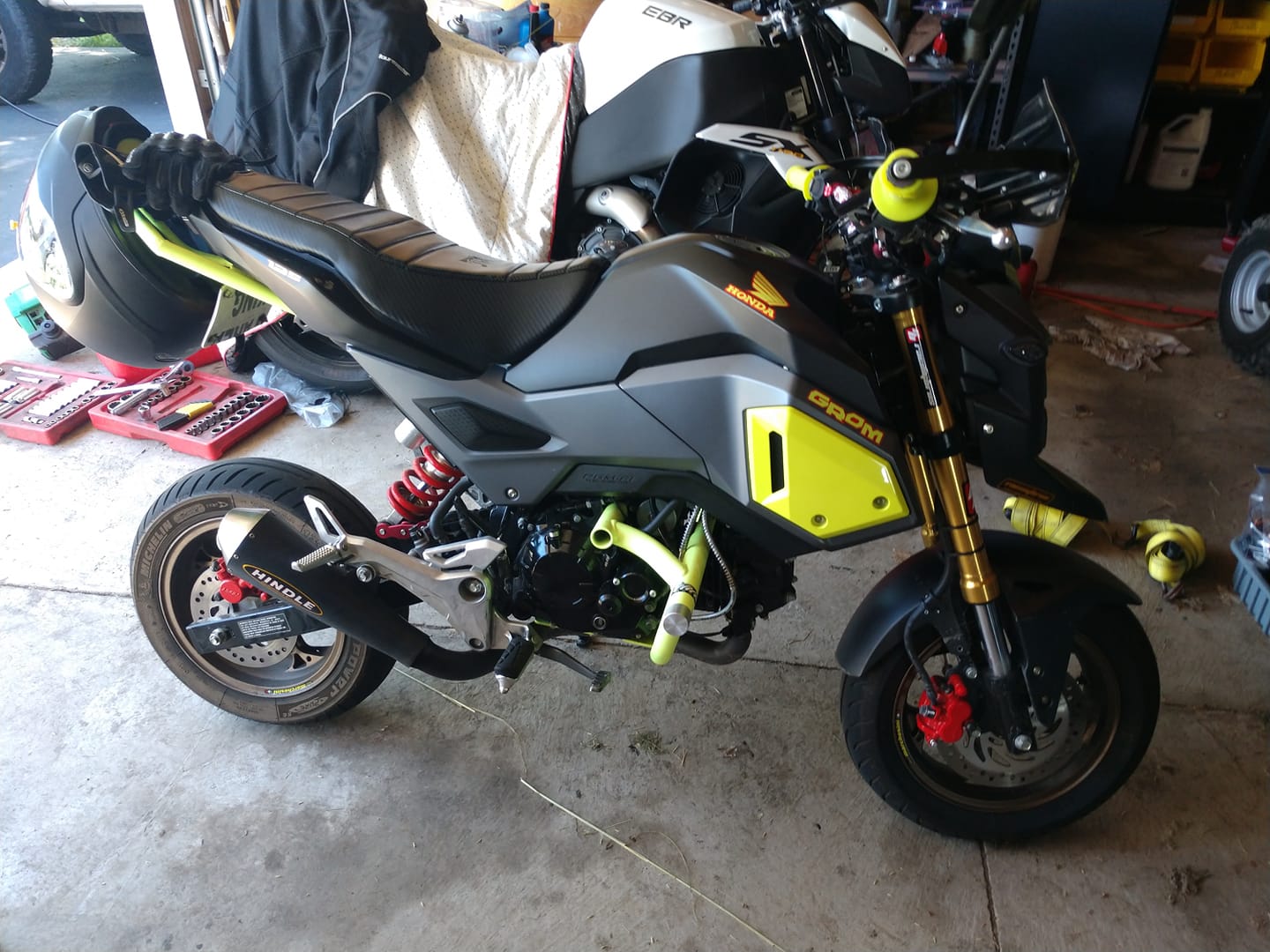 Finished Honda Grom 300 swap — gold Öhlins inverted forks, neon yellow accents, BST carbon wheels, orange Brembo calipers, Hindle exhaust, Kemimoto rearsets