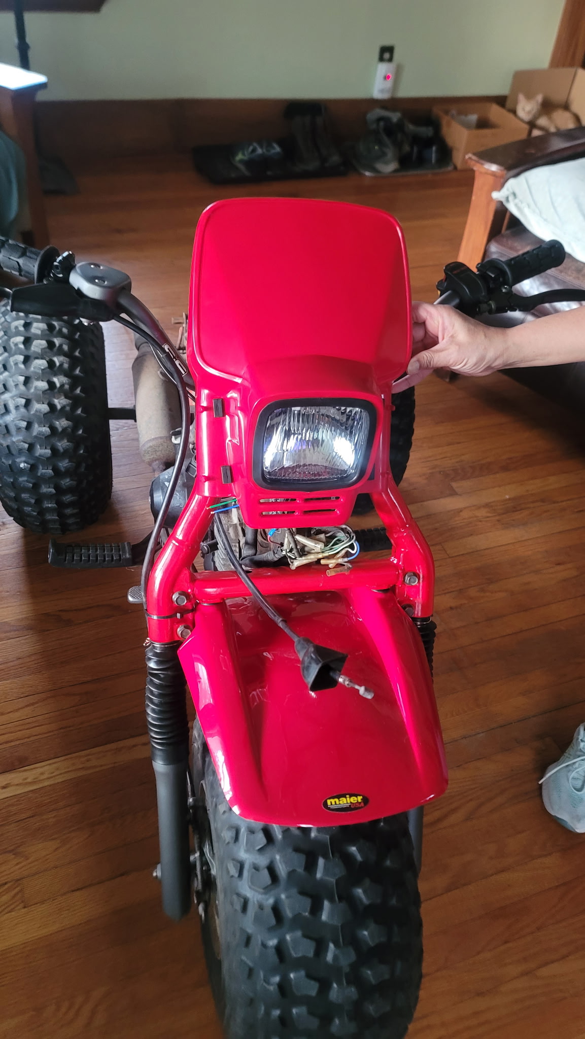 Scott's Honda ATC 125 from the front showing the 185S fork swap with headlight mounted and wiring visible